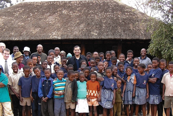 Vasquez visits an orphanage in South Africa while traveling as director of the Peace Corps.