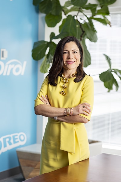 Christine Montenegro McGrath, Mondelēz International, standing arms crossed, vertical image