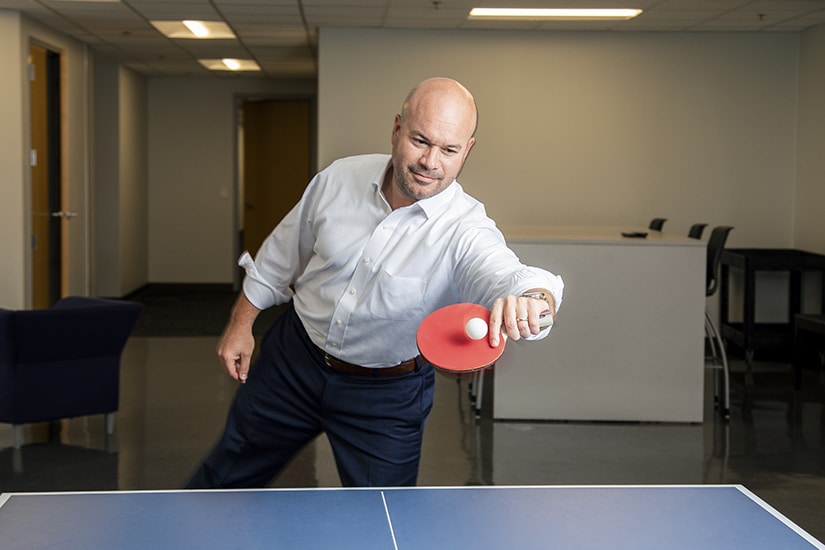 Ricardo Madan, TEKsystems, playing ping-pong
