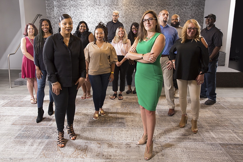 Jennifer Rodriguez, FCB Global, center of group shot standing arms crossed
