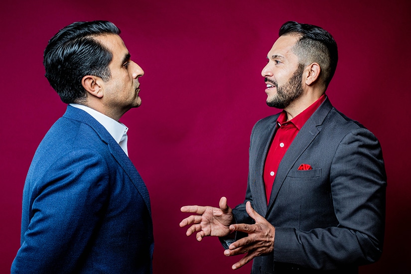 Mark L. Madrid in discussion with Pedro A. Guerrero