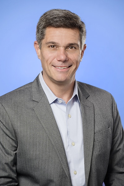 Ricardo Pravda, CHRO, Catalent, portrait blue background