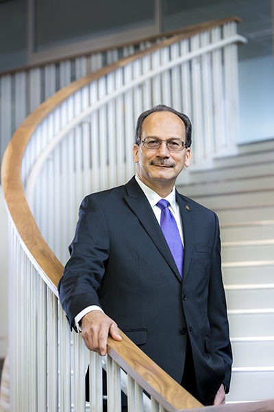 Havidán Rodríguez, President, University at Albany - portrait on stairs