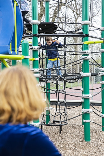 Talita Ramos Erickson watching her son play at a playground Northbrook on April 26, 2019