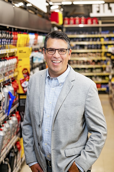 Adolfo Rodriguez, SVP of IT Transformation, Advance Auto Parts_portrait gray jacket
