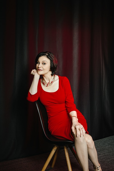 Catherine Hernandez-Blades, Aflac, portrait sitting hand on chin