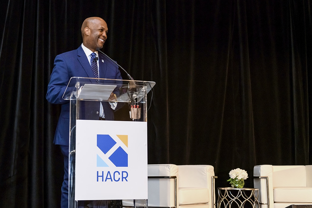 Cid Wilson, President and CEO of HACR, speaking at a podium