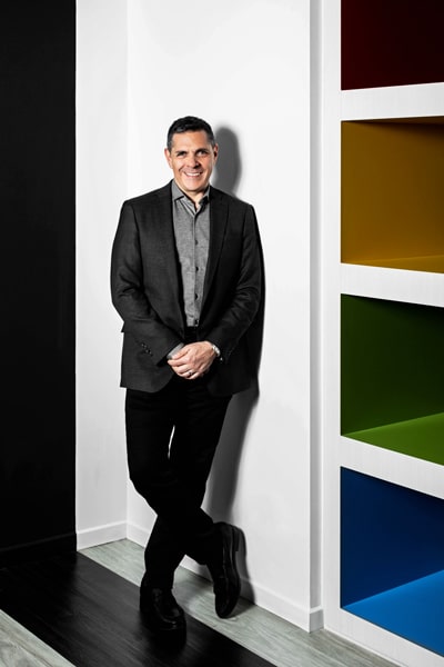 Daniel Lubetzky, KIND Snacks, standing against wall