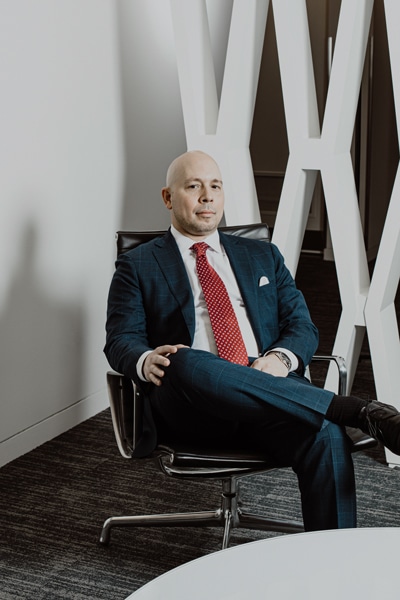 Rob Negron, AXA Equitable Life Insurance, portrait sitting legs crossed