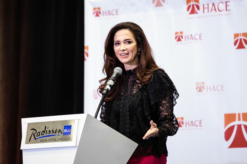 Claudia Romo Edelman keynote speech at podium