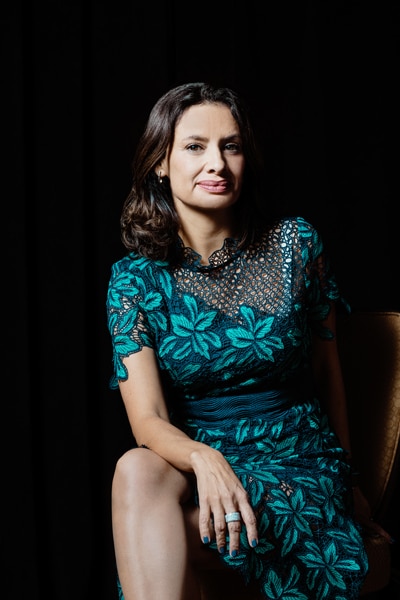 María Teresa Kumar, founding president and CEO, Voto Latino, portrait sitting leaning forward