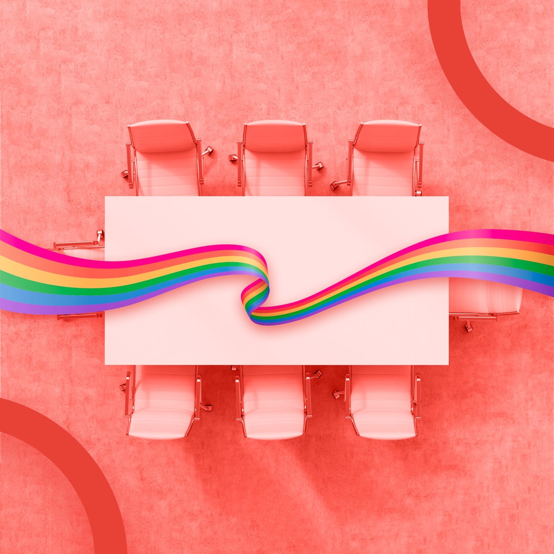 boardroom table and LGBTQ+ flag
