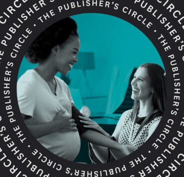 A nurse takes a pregnant Black woman's blood pressure with a blood pressure cuff