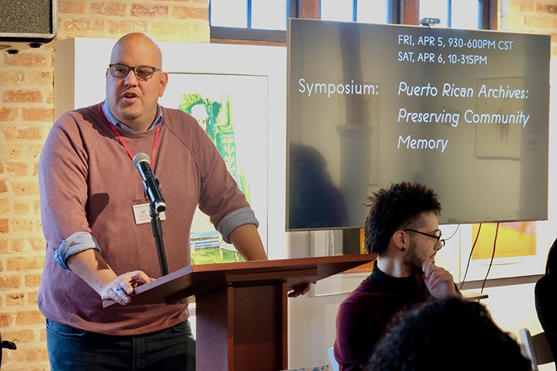 Dr. Michael Rodríguez-Muñiz, co-director of Digitizing the Barrio and associate professor of sociology at University of California, Berkeley, addresses the audience of the Puerto Rican Archives Symposium.